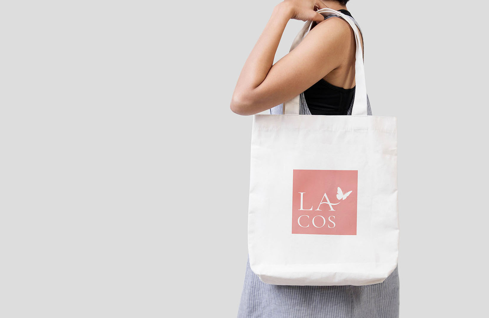 Girl is holding bag canvas fabric for mockup blank template.